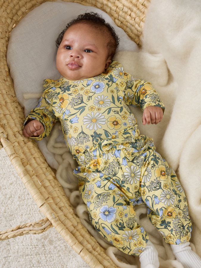 Body med volanger blomster Body med volanger blomster