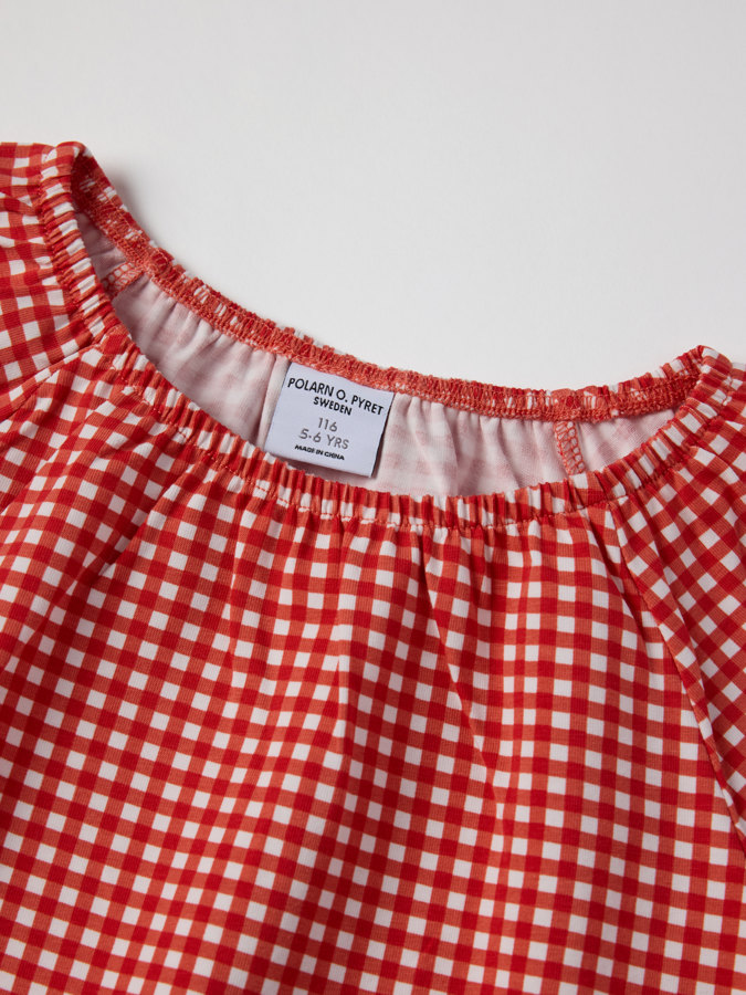 Topp med puffermer rutet Topp med puffermer rutet