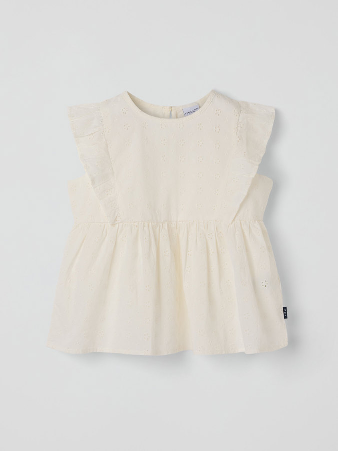 Vevd bluse med volanger